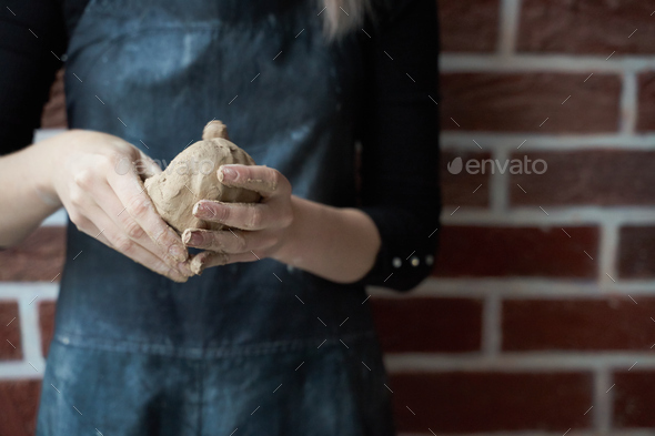 Unrecognisable woman making ceramic bowl in hand. Creative hobby concept - Stock Photo - Images