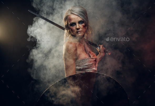 Woman warrior wearing rag cloth stained with blood - Stock Photo - Images