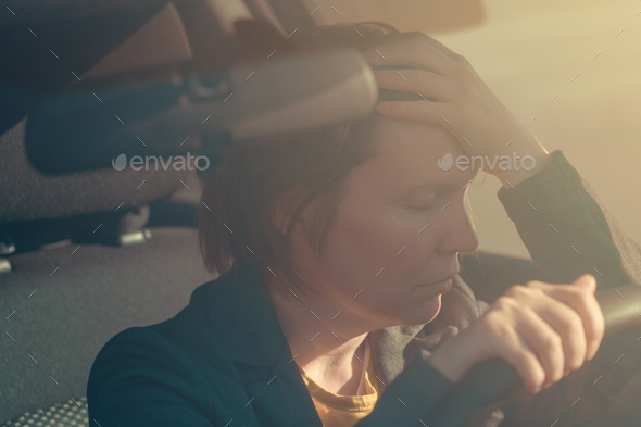 Disappointed businesswoman in car - Stock Photo - Images