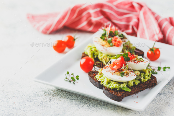 Toast with avocado and egg - Stock Photo - Images