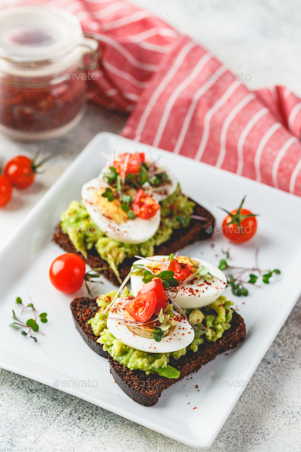 Toast with avocado and egg - Stock Photo - Images