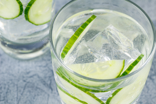 Infused water with cucumber and ice - Stock Photo - Images