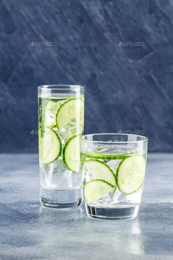 Infused water with cucumber and ice - Stock Photo - Images