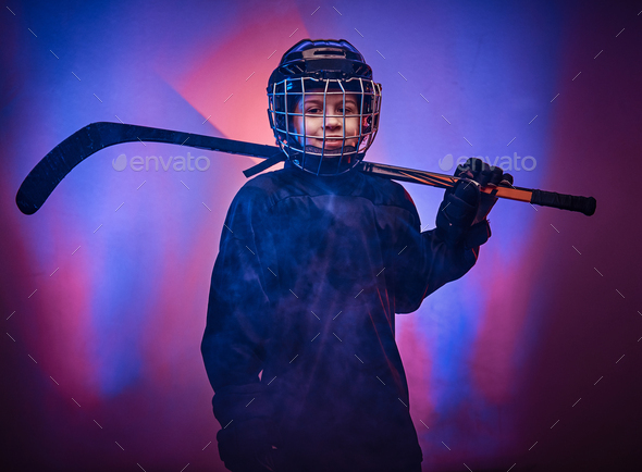 Young Rookie Hockey Player Dressed in Practice Jersey Poses In Dressing  Room at Hockey Rink with his Stick in hand and helmet at his side Stock  Photo - Alamy