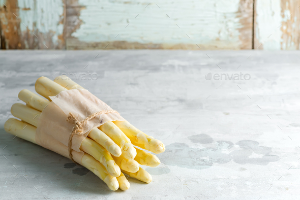 Organic food. Healthy food cooking concept. Uncooked Freshly picked raw organic white asparagus - Stock Photo - Images