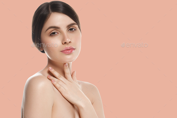 Beauty woman over pink background healthy skin - Stock Photo - Images