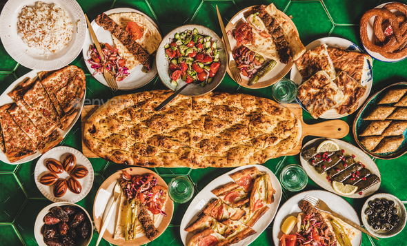 Muslim Ramadan iftar dinner with Turkish typical foods, copy space Stock Photo by sonyakamoz