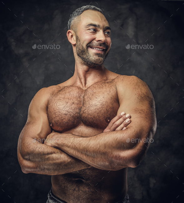 Adult caucasian muscular bodybuilder in a studio - Stock Photo - Images