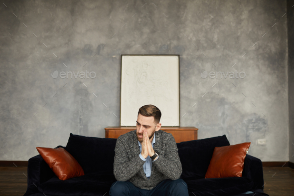 Disappointed businessman on the sofa - Stock Photo - Images
