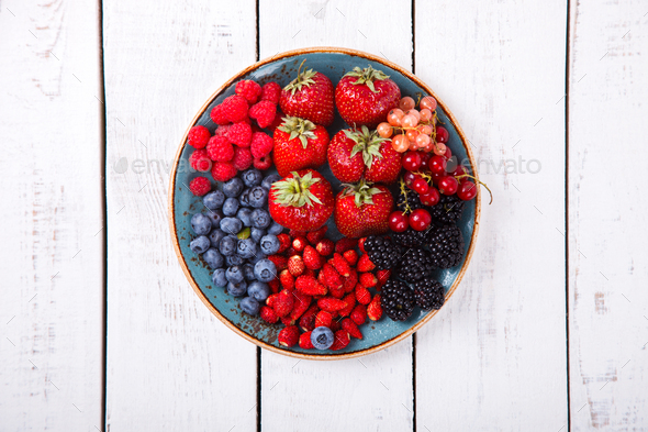 Various Fresh Summer Berries on a white Background.F - Stock Photo - Images