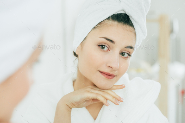 Woman in mirror bathroom making makeup, natural beauty female, beautiful model in bathroom