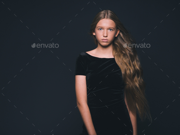 Long hair beauty girl healthy curly long hairstyle blonde in black dress  Stock Photo by kiraliffe