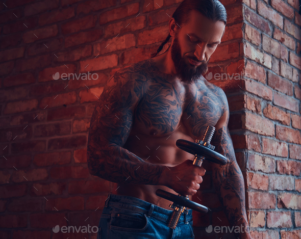 Male with tattoo on arms in studio Stock Photo by fxquadro 68915787