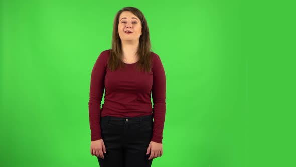 Pretty Girl Says Wow, Waves Her Head Approvingly, Green Screen alt