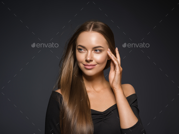 Smooth beauty woman long hair brunette female model natural makeup beautiful girl dark background