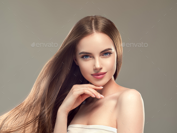 Woman with long smooth hair beautiful hairstyle fashion make up Stock Photo  by kiraliffe
