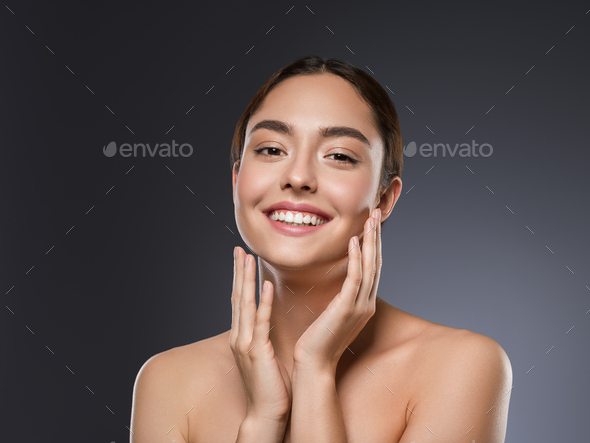 Teeth smile happy woman beauty face hand touching face