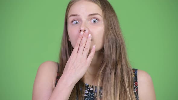 Young Beautiful Woman with Long Blond Hair Looking Surprised alt