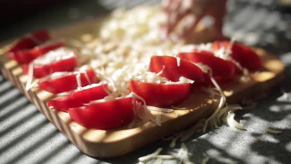 Slices of Cheddar and Colby Cheese Disappearing From a Stack on a Cutting Board Stop Motion