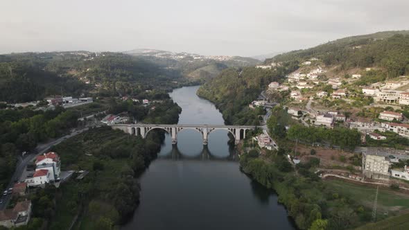 Ponte Duarte Pacheco bridge, Tâmega River, Entre-os-rios, Portugal. Aerial pullback