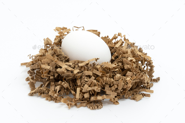 One white chicken eggs on nest isolated on white background