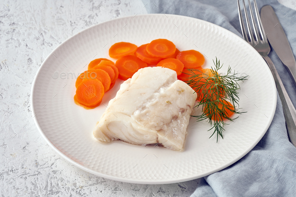 Boiled codfish with carrot and dill on white plate, fodmap dash paleo diet