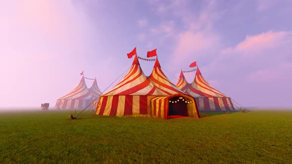 Large circus tents set up in a field