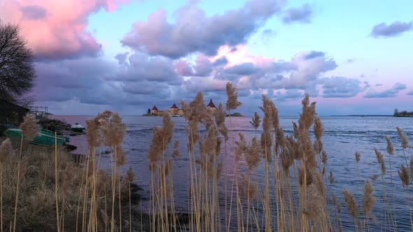 The Fortress on the Water Slowly Appears From Behind the Reeds