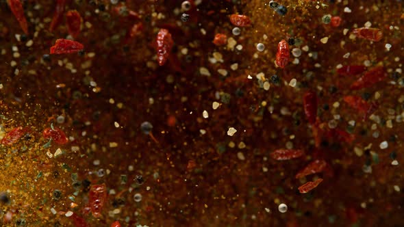 Super Slow Motion Shot of Colorful Seasoning Explosion on Black Background at 1000Fps alt