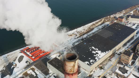 Aerial Video on the Chimney of an Power Plant From Which White Smoke Comes Out alt