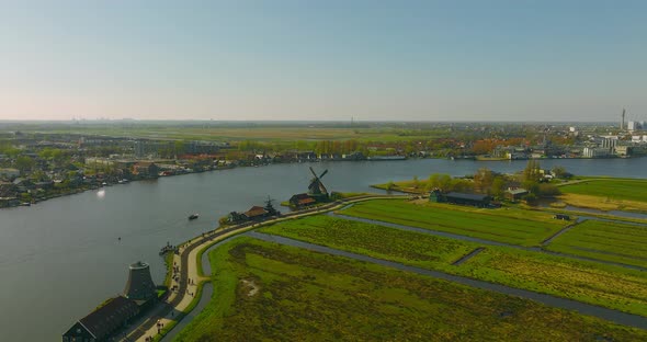 Classic Dutch windmill at Famous tourist location of Zaanse Schans at the outskirts of Amsterdam alt
