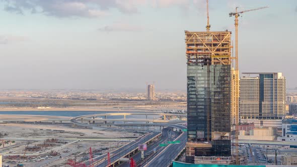 Construction Activity in Dubai Downtown with Cranes and Workers Timelapse UAE alt