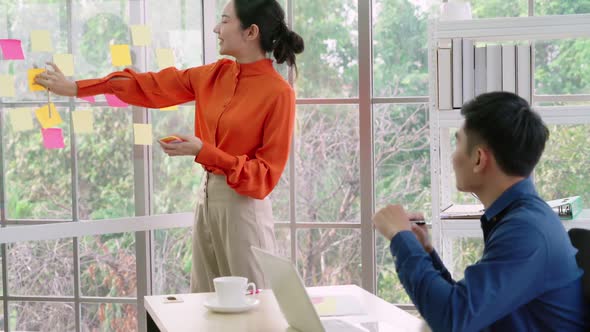 Business People Work on Project Planning Board alt