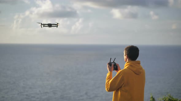 Man Traveler Takes Photos or Video Using Drone