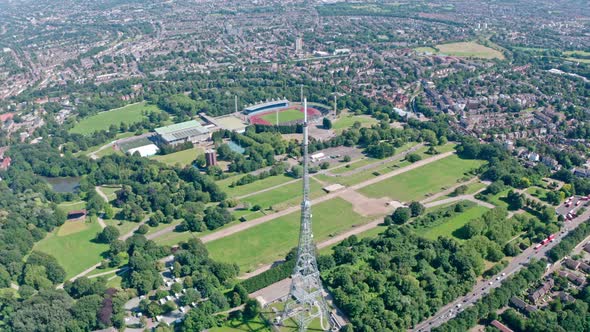 Dolly forward drone shot towards Crystal palace park and radio tower alt