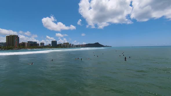 Waiting for the Swell, Aerial Drone FPV Shot over Surfers on Gorgeous Blue Water of Oahu alt