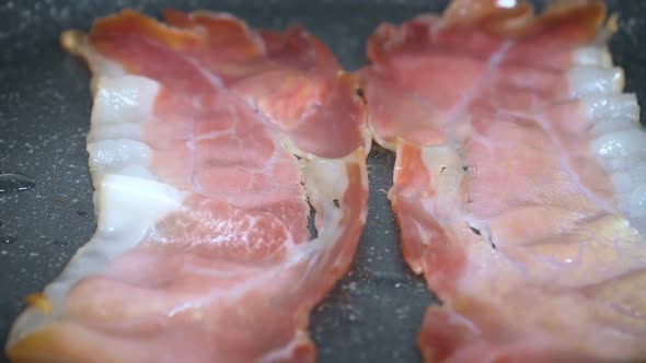 Slices of Bacon in Pan