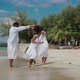 African American family having fun together on the tropical beach on vacation. - VideoHive Item for Sale