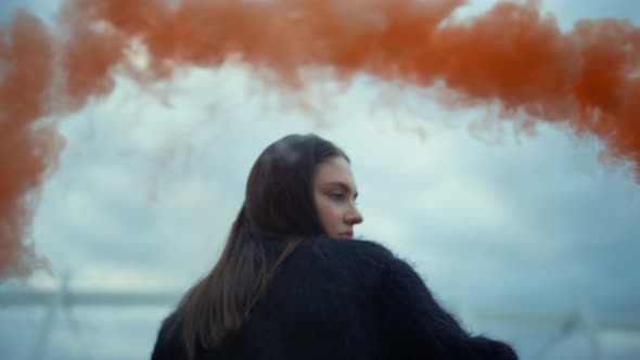 Girl Waving Hand at Camera with Smoke Bomb, Young Woman Posing at Camera alt