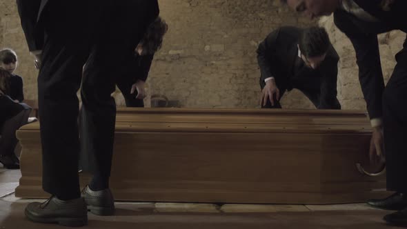 Pallbearers leaving Church with coffin