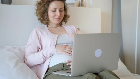 Pregnancy, Technology, People And Leisure Concept. Pregnant Woman With Laptop. alt
