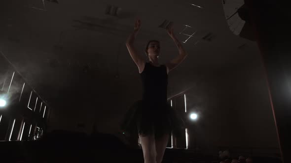 Slow Motion Prima Ballet in a Black Dress Performs Rotations and Dance Graceful Movements Rehearsing alt