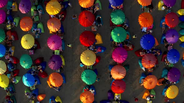 Colourful Beach Umbrellas and People Enjoying the Summer in Seminyak Beach alt
