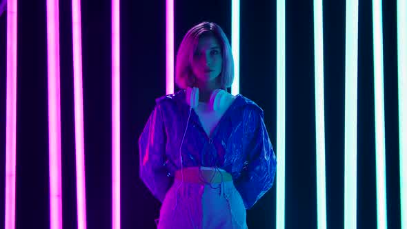 Portrait Young Stylish Woman Big White Headphones Looking Straight Into Camera alt