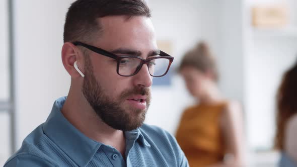 Bearded Businessman Having Conversation by Video Link alt