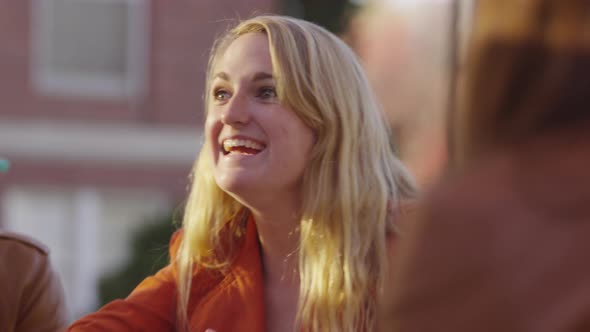 Closeup of college student on campus talking to classmates