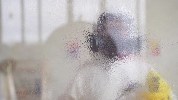 Disinfector in Protective Clothing Is Treated Treatment with a Spray alt