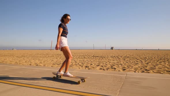 Young Active Woman Enjoyed Riding And Dancing On Skateboard At Summer. - close up alt