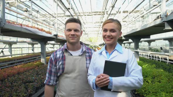 Quality Control Officer and Farmer Smiling in Greenhouse, Market Requirements