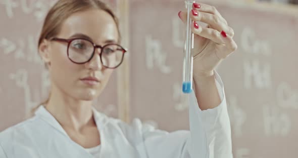 Young Laboratory Scientist Works in a Scientific Laboratory alt